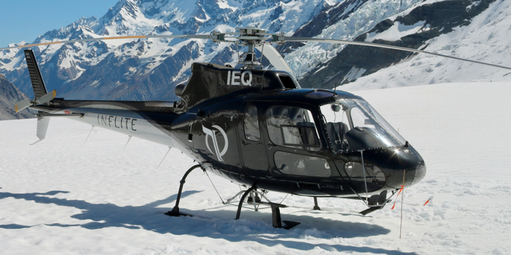 helicopter in snowy mountains, charter private helicopter